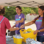 Volunteers hand out goodies