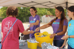 Volunteers hand out goodies