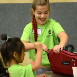 Volunteers fill backpacks