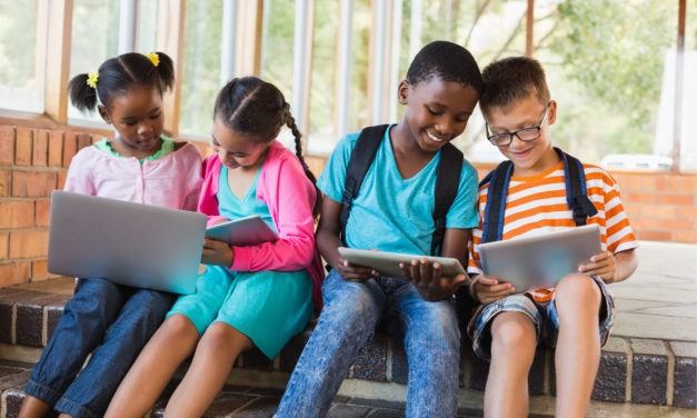 Elementary Students Bring District Issued Devices For First Day of In-Person Learning