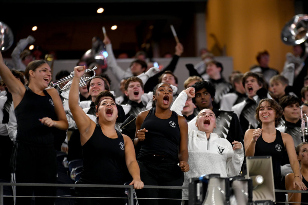 Vandegrift HS dance students cheer form the stands