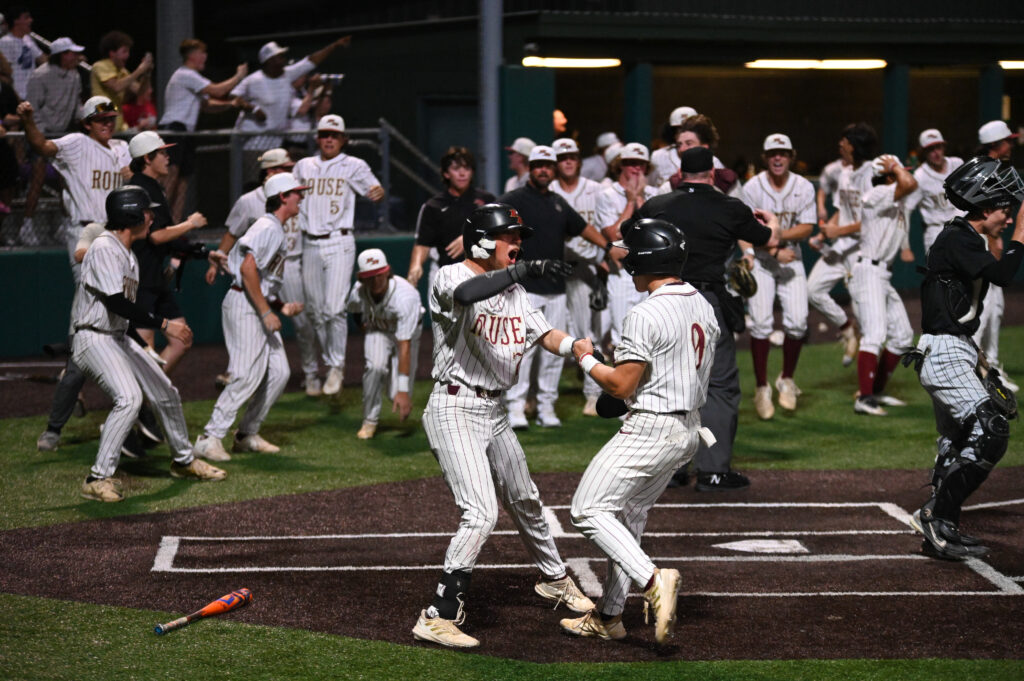 LISD Rouse High School Baseball players celebrating victory.