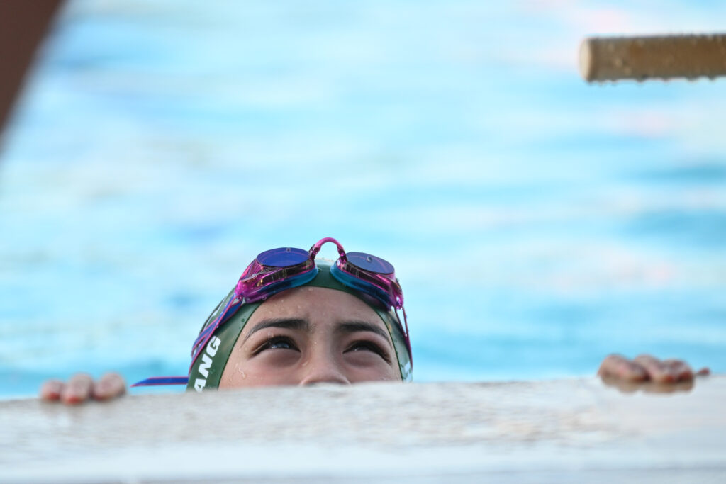 student in the pool looking up