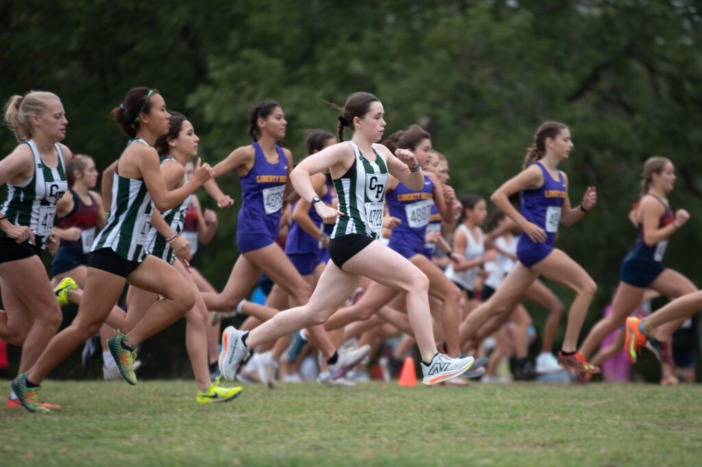 Cross country athletes running