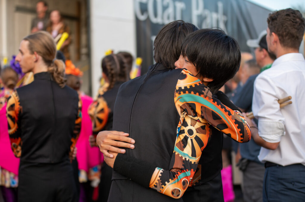 UIL State Marching band championships competitors embracing