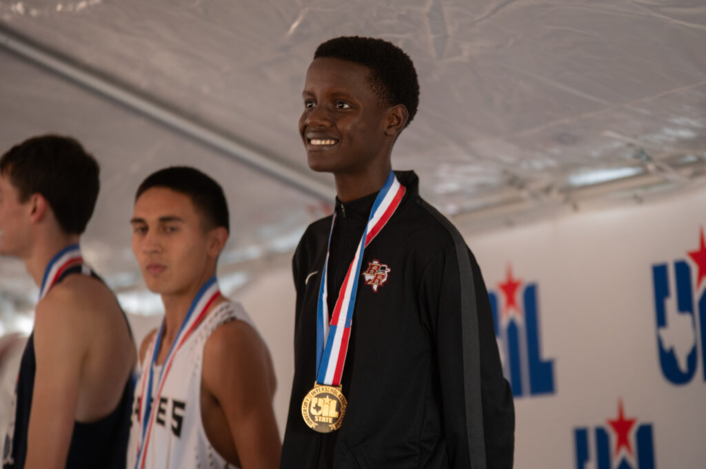 Cross country runners receiving medals