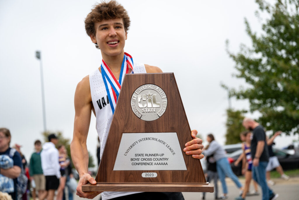 Cross country runner-up student with award