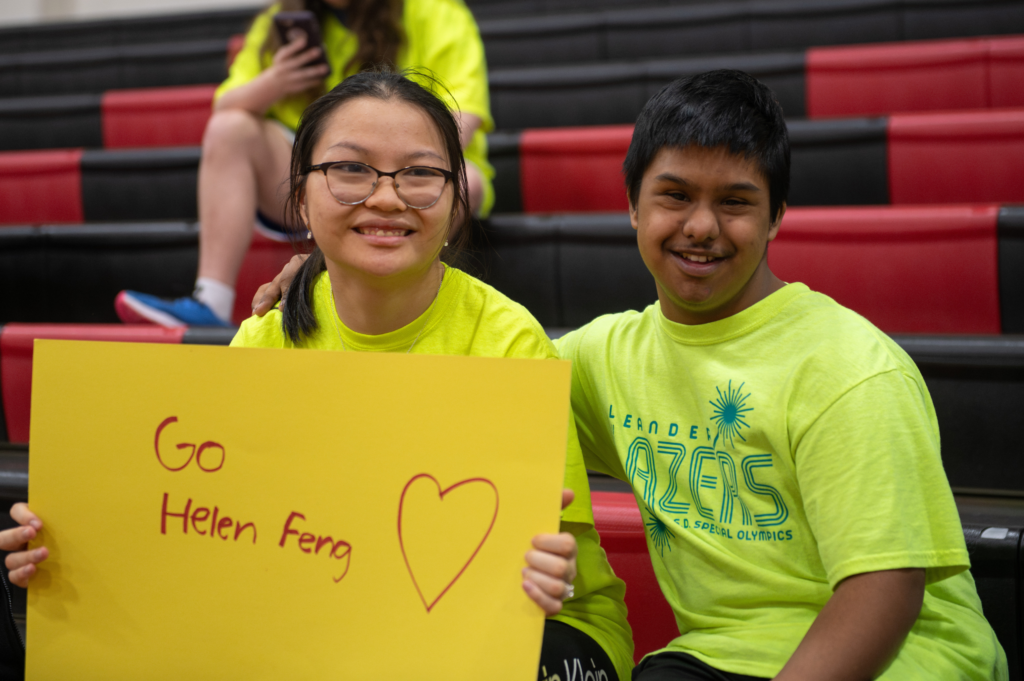 Leander Lazers holding a support sign