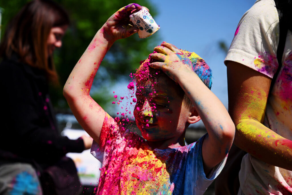 Festival of colors participant covered in bright colors