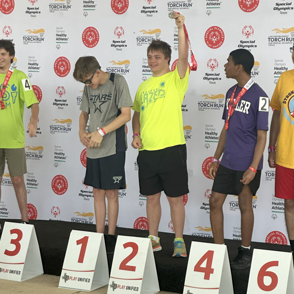 Leander Lazers Special Olympics Summer Games team member on the podium