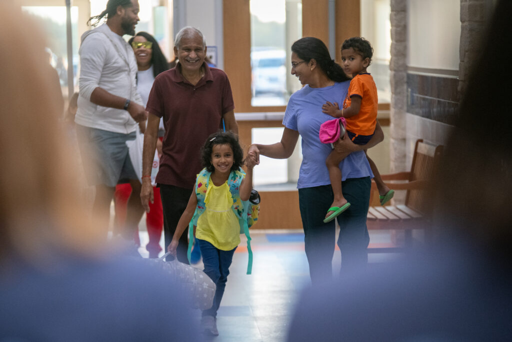 Parents dropping off kids for first day of school