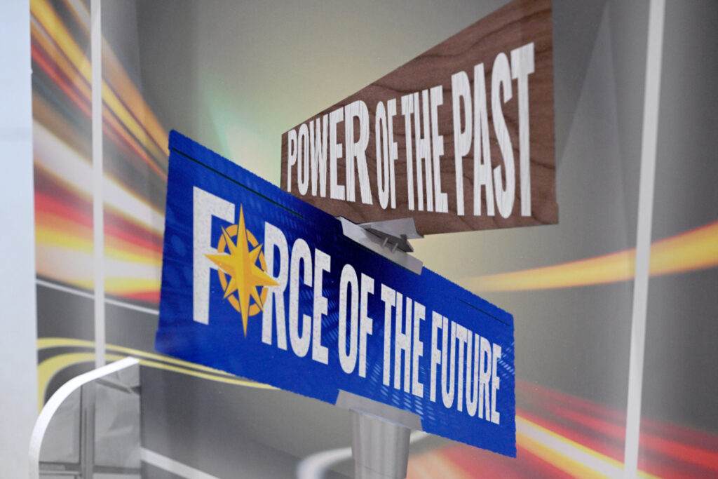 Intersecting signs that say, Power of the past and Force of the future