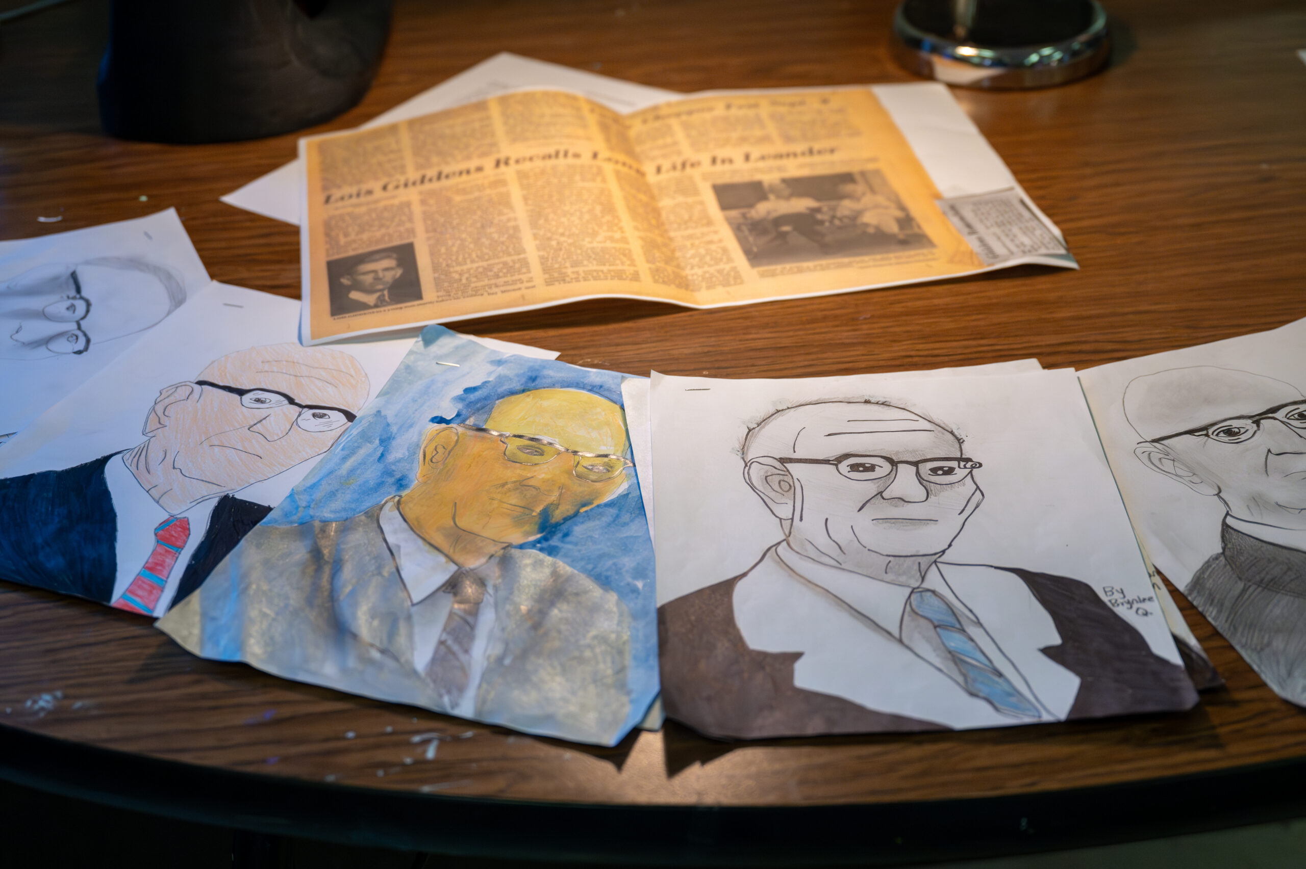 Portraits of Lois Giddens, drawn by Giddens Elementary School students