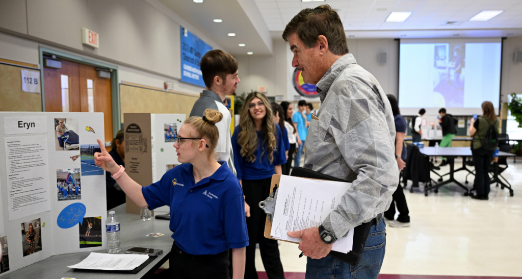 A student and employer participate in the Leander ISD Vocational Services Reverse Job Fair.