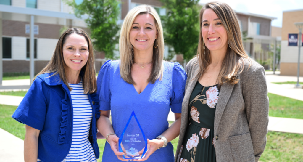 The LISD CTE team poses with their CTE District of Distinction Award