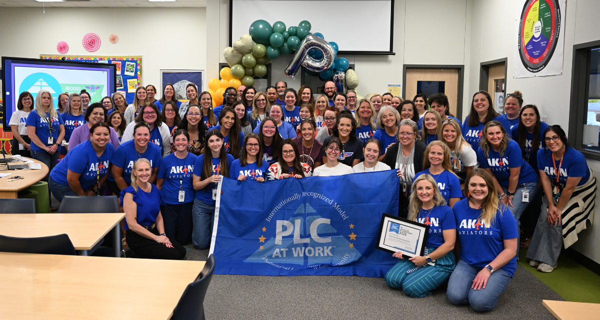 Akin ES educators pose with their Model PLC Recognition at Work